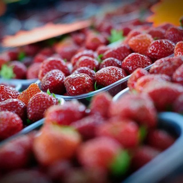 Fresh local strawberries at the Fête de la Fraise market in Dordogne