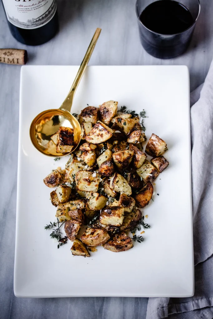 Red wine and black truffles on a rustic wooden board – a perfect pairing for a gourmet experience