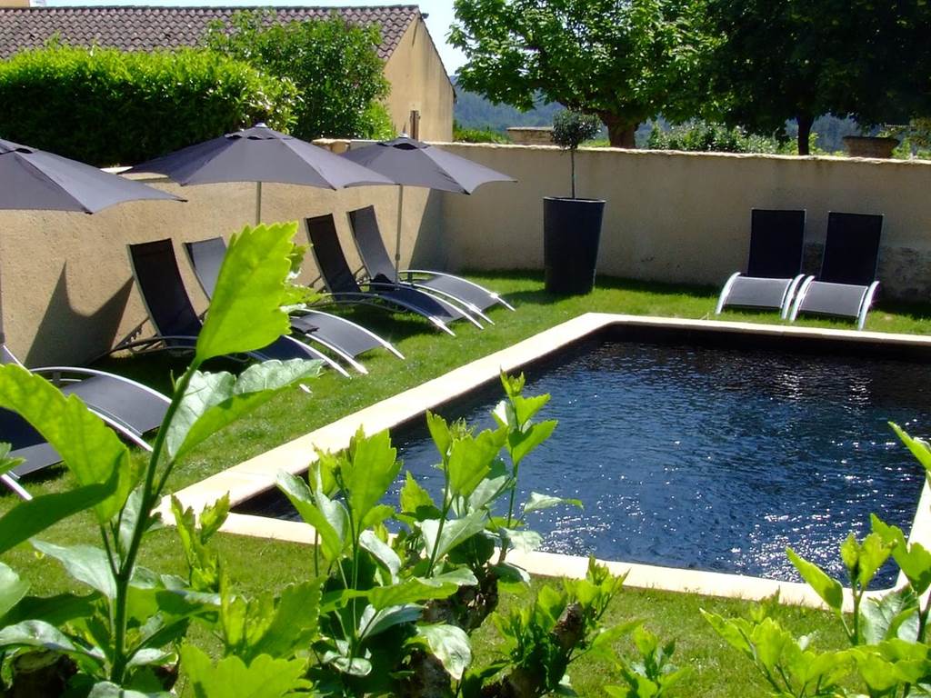 Outdoor pool and garden at Maison de Marquay, a traditional stone house near Sarlat